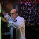 A drunken Bernanke attempts to find the Aerosmith song "Back In The Saddle" on the bar jukebox.